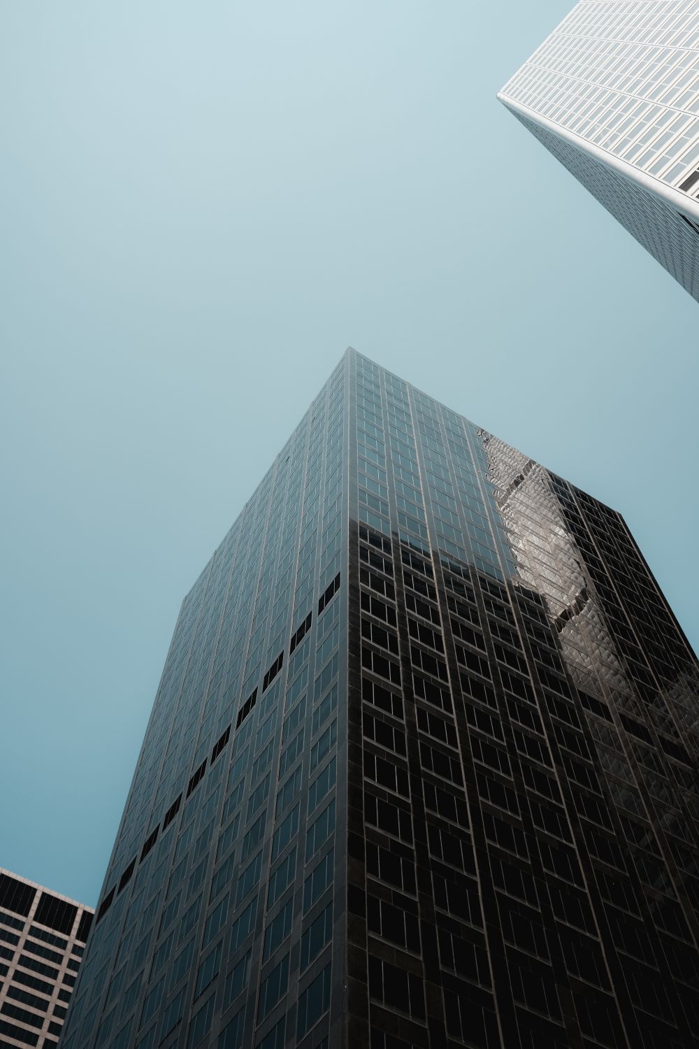 Tall buildings against a blue sky